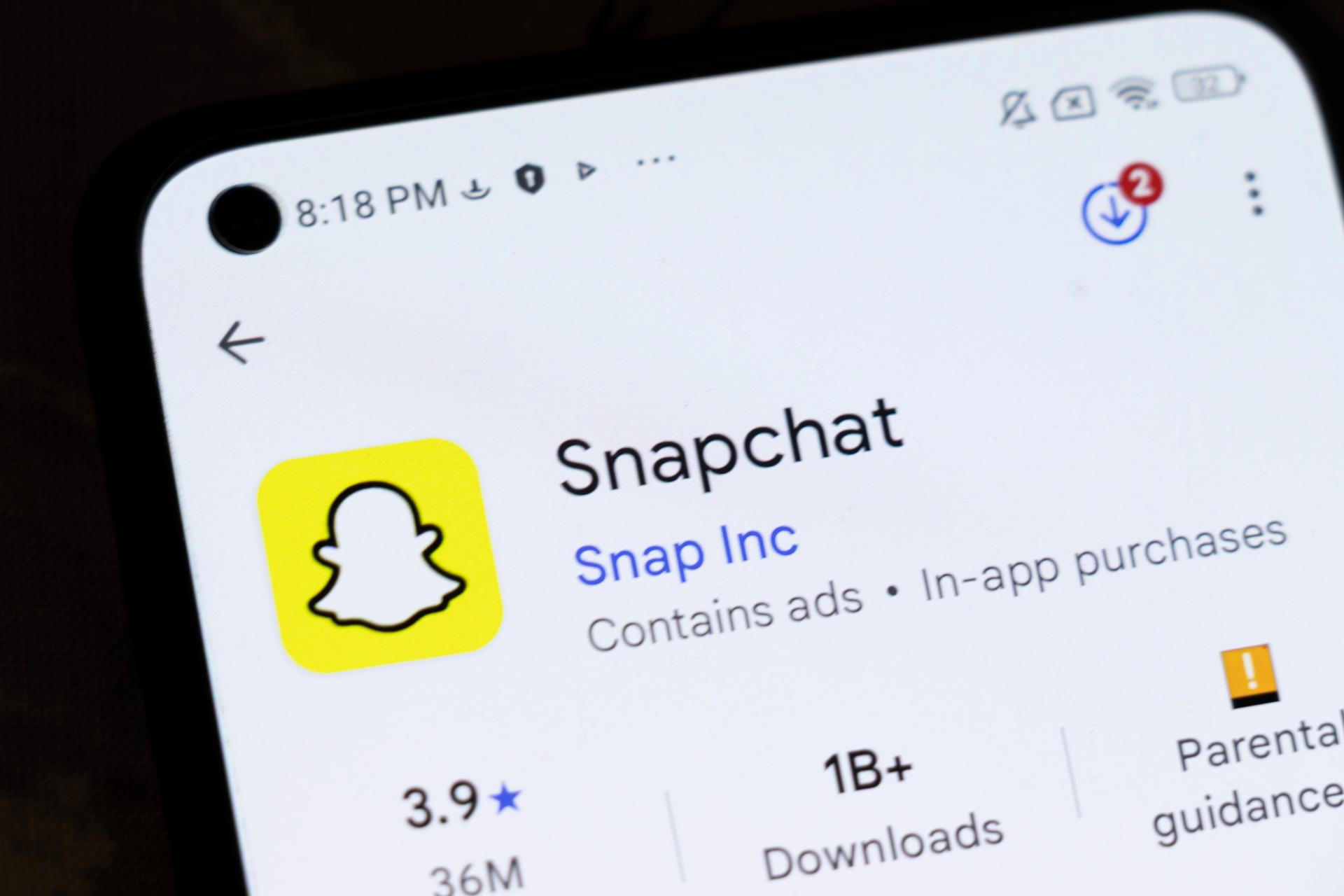 Smartphone displaying Snapchat app page, showcasing features of Snapchat AI Tools for advertising