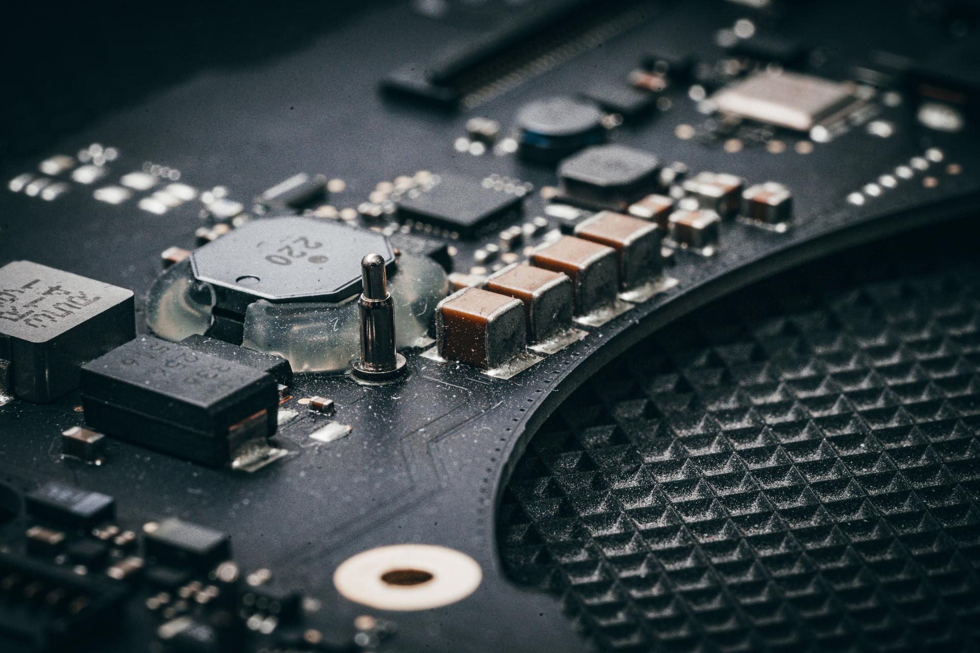 Close-up of circuit board components illustrating Google's AI hardware manufacturing challenge