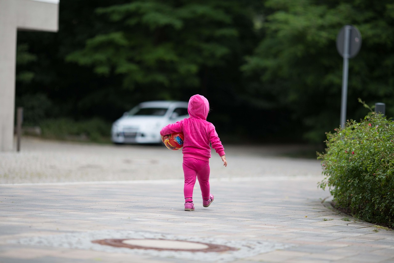Child playing outdoors illustrates why AI agents need careful human supervision.