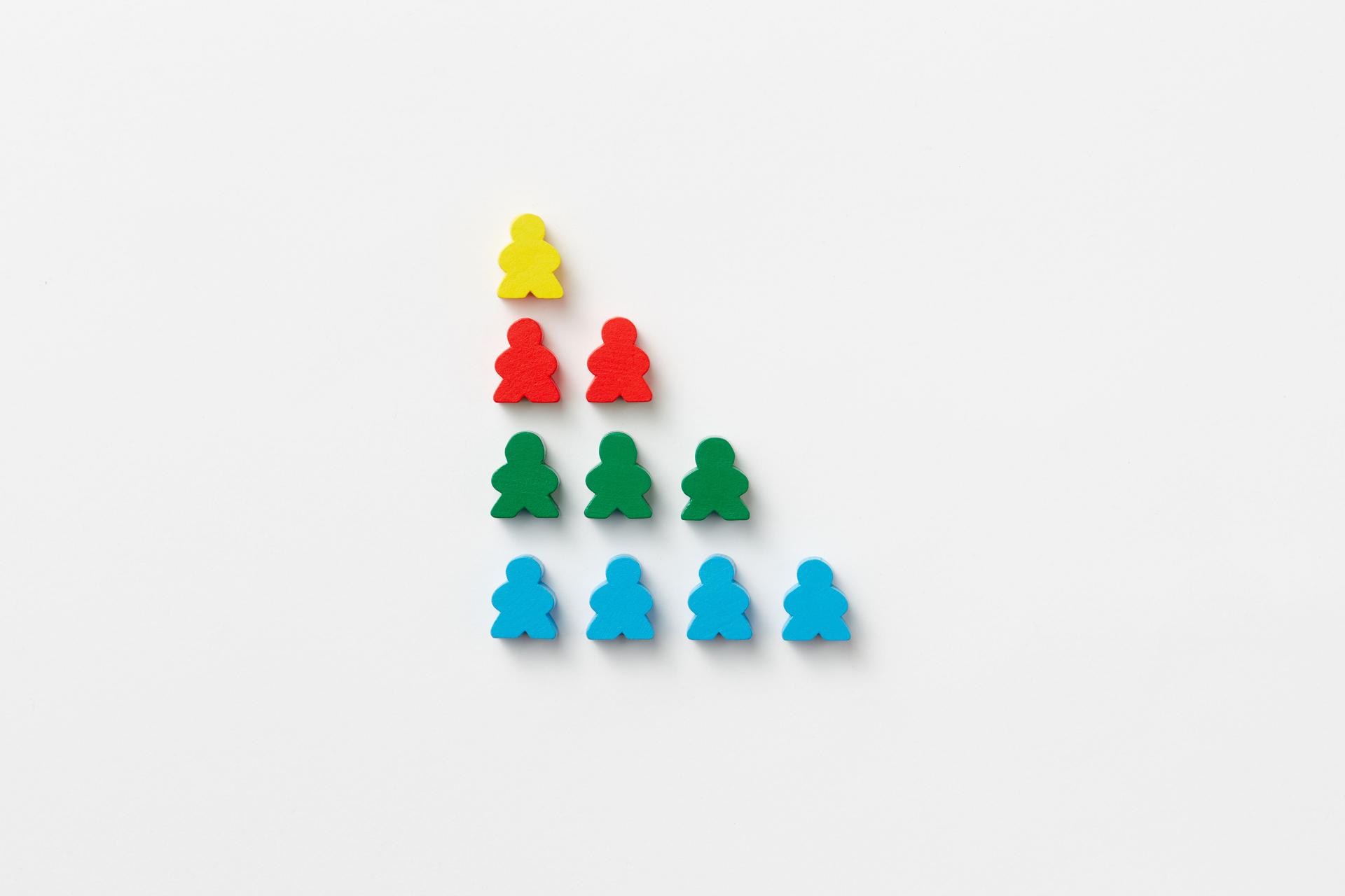 Colorful pawn pyramid illustrating the uneven AI capability gap between everyday users and specialists