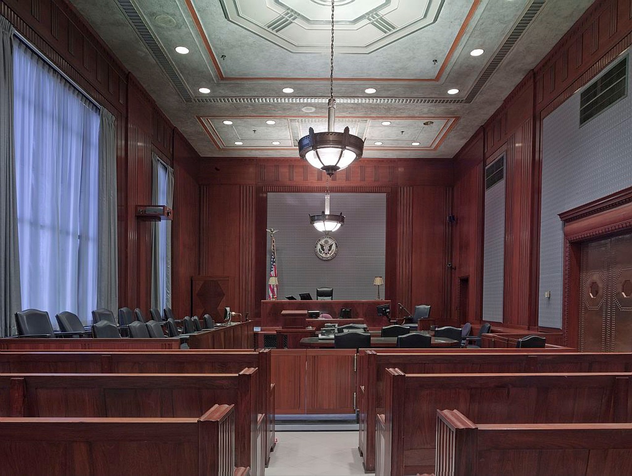 Courtroom Scene on AI Laws and Antitrust Issues An empty courtroom illustrating the setting for legal debates on AI laws and antitrust issues.