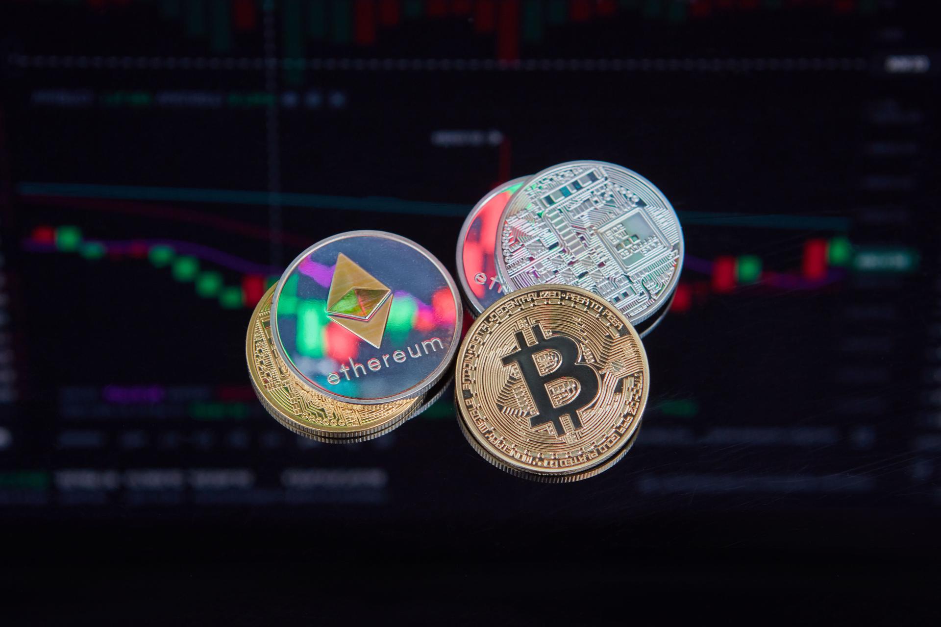 Cryptocurrency coins like Bitcoin and Ethereum, symbolizing the rising interest in Worldcoin after OpenAI's IPO news