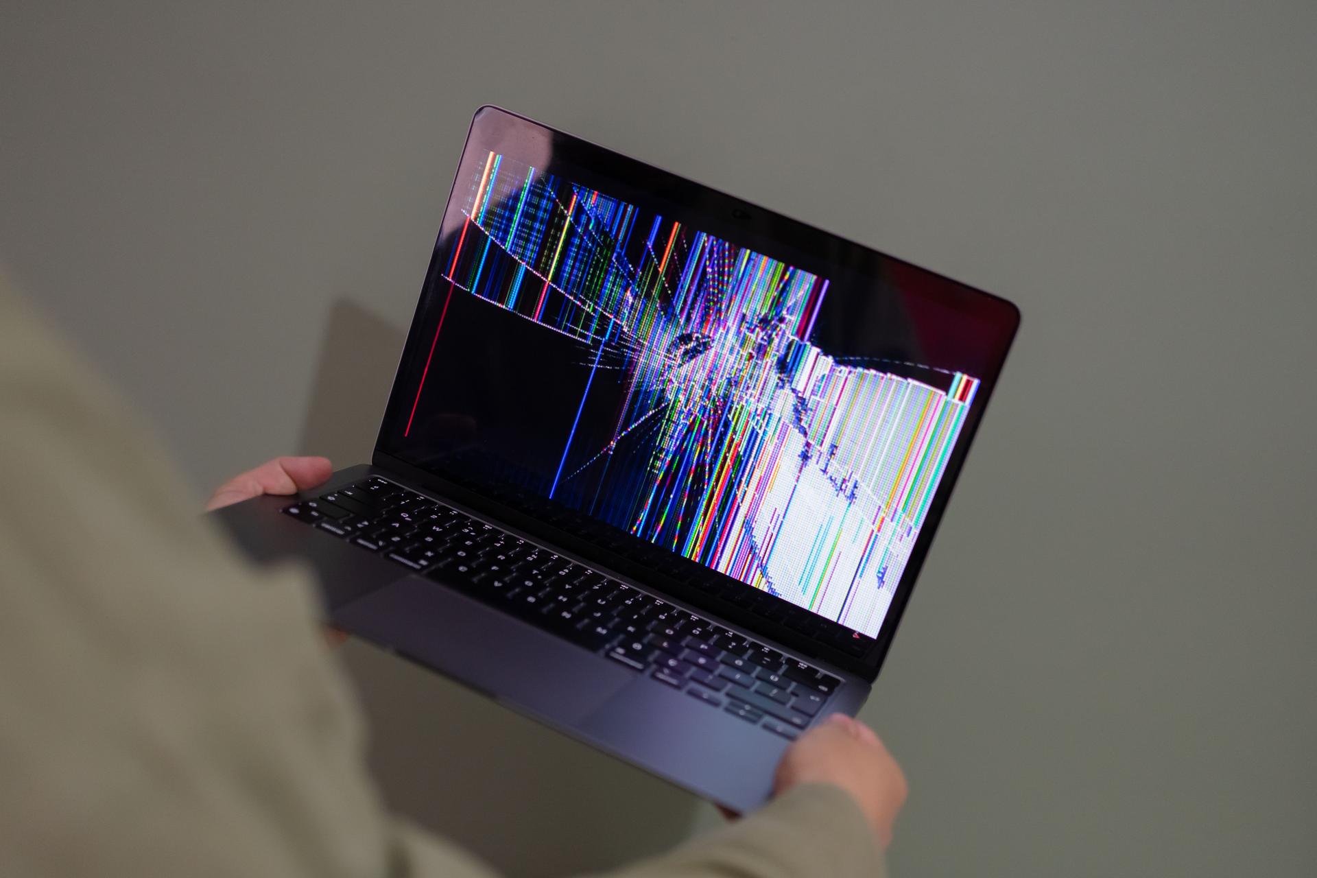 Damaged laptop screen highlights vulnerabilities in AI containment