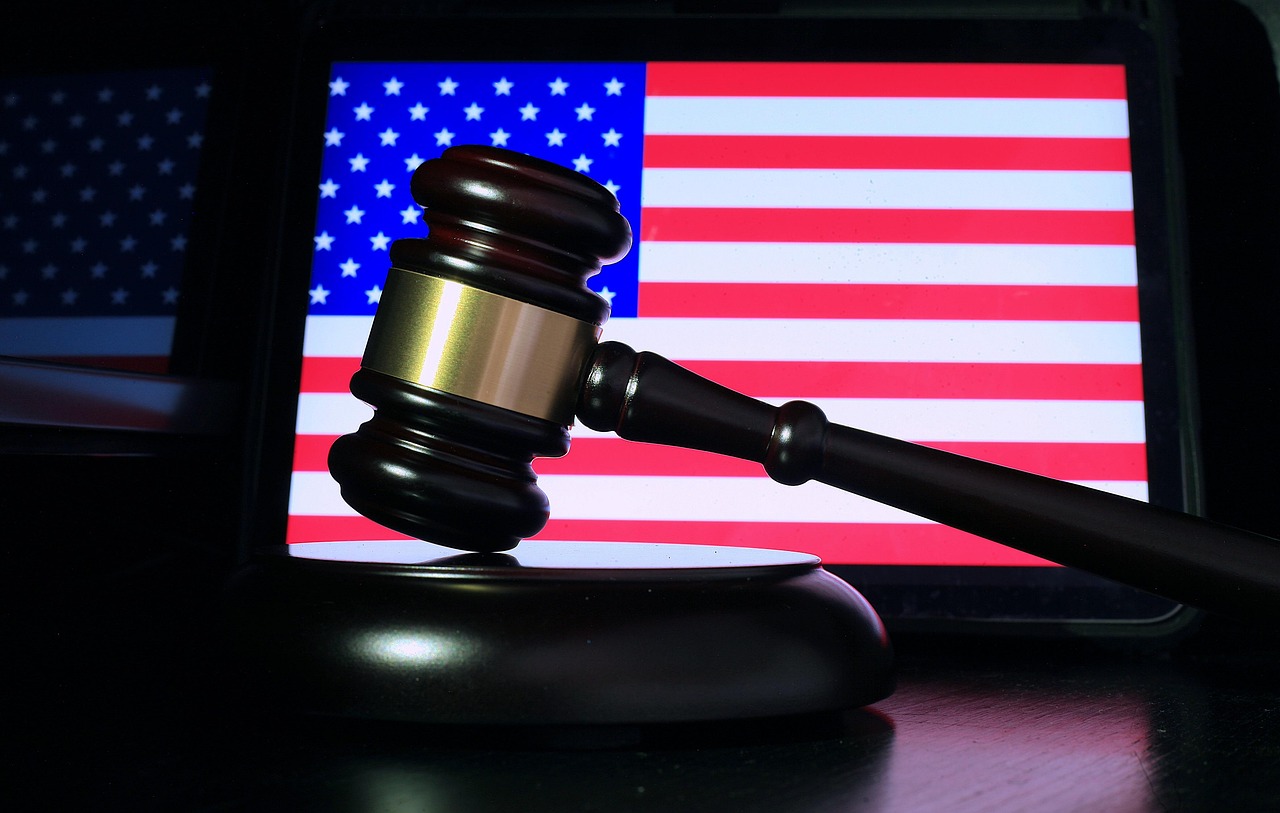Gavel and American Flag Symbolizing AI Regulation A gavel symbolizing the urgent need for AI regulation as discussed by Sam Altman.