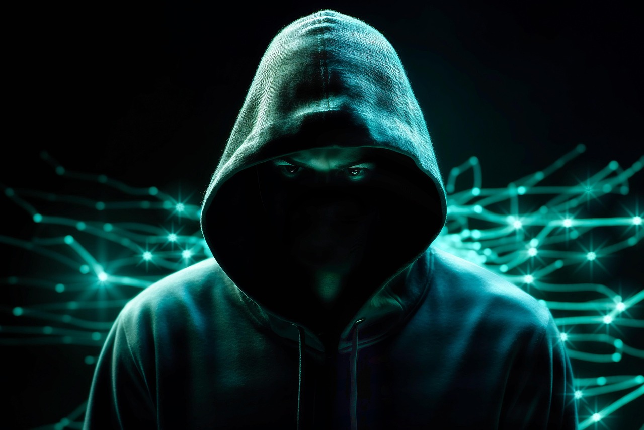Mysterious Hacker Representing AI Security Threats A hooded figure symbolizes AI attacks in cybersecurity, highlighting urgent ai security concerns.
