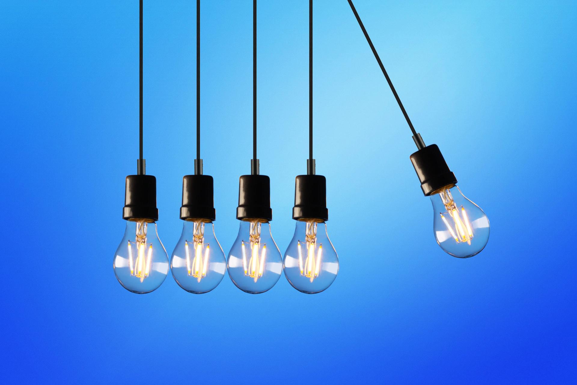 Illuminated light bulbs symbolize innovation amidst laws on artificial intelligence debate.