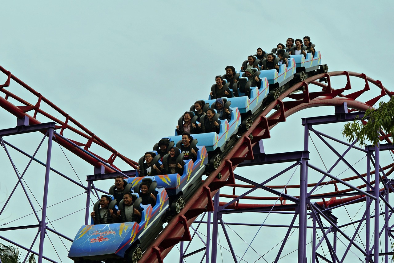 A roller coaster ride representing the thrilling pace of AI model releases like Anthropic's Sonnet 5.5.