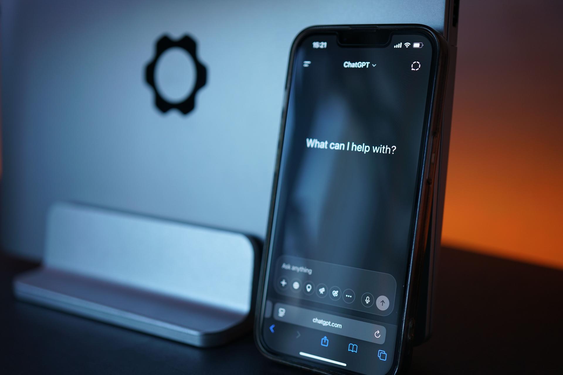 AI Chat Interface Showing Security Insights Smartphone displaying AI chat interface, highlighting OpenAI's technology amid security weaknesses.
