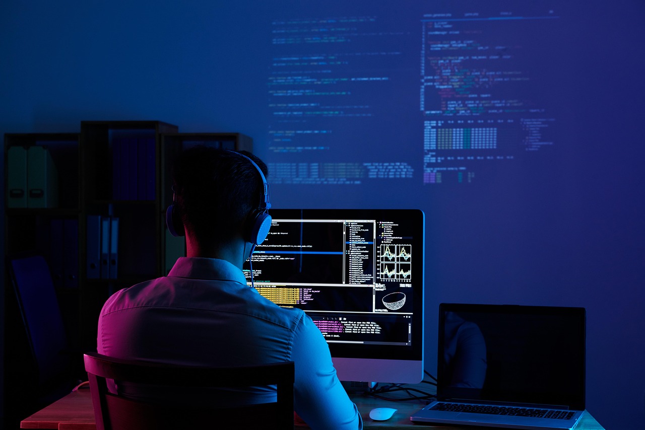 A software developer analyzes code while contemplating OpenAI's security breaches.