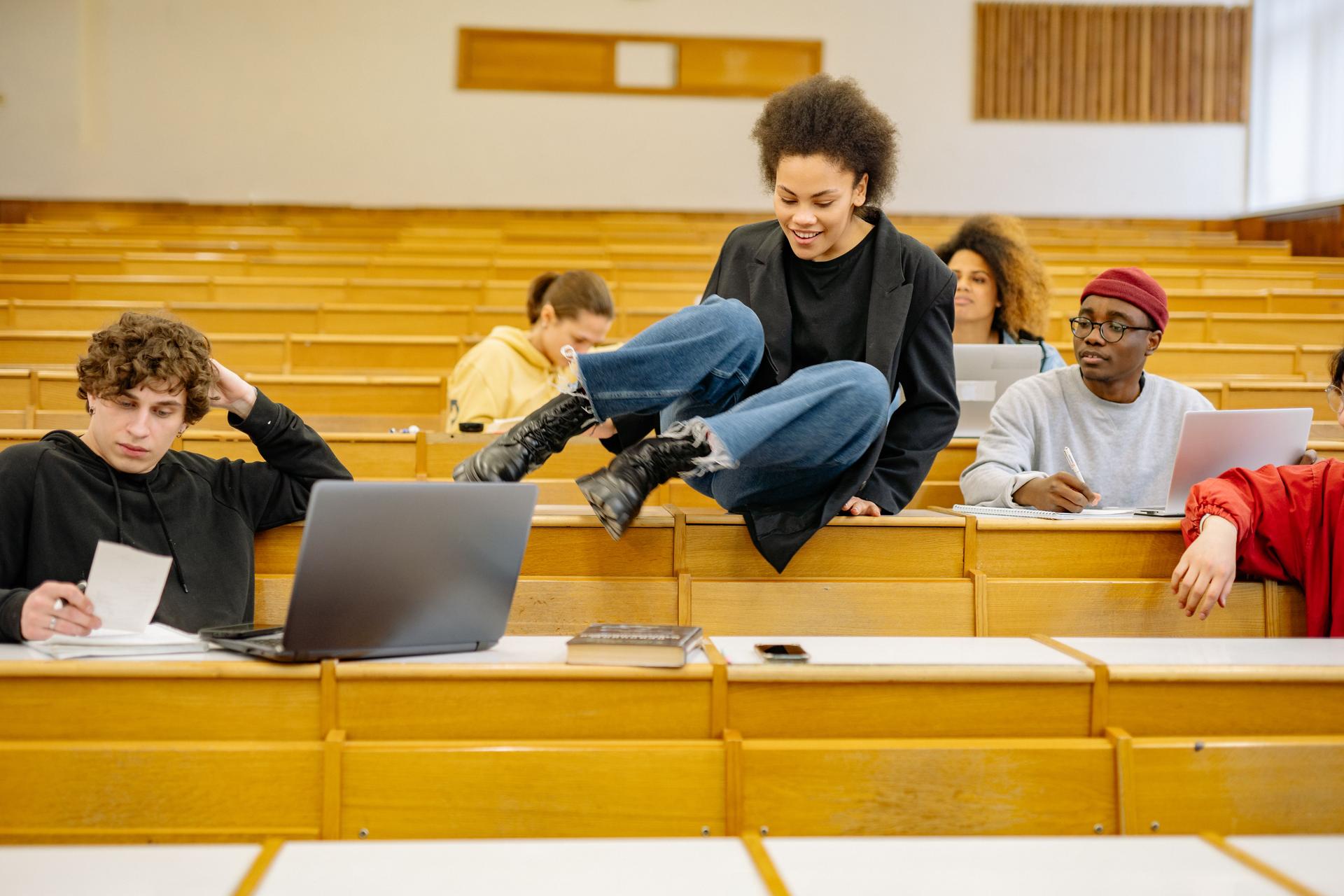 Students in a classroom engaging with AI tools, highlighting the need for proper ai detection training.