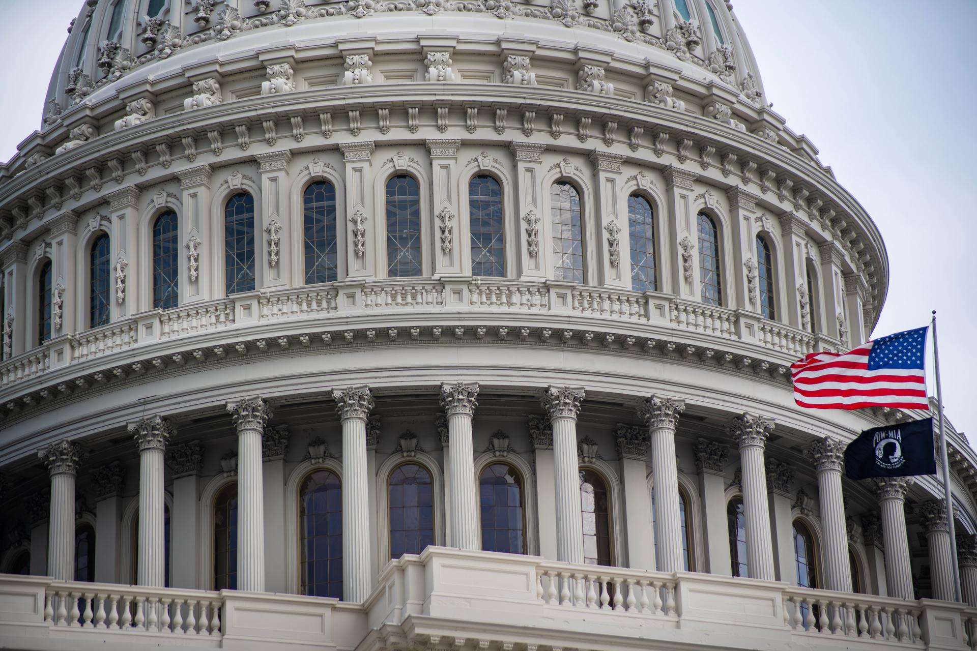 The US Capitol dome symbolizes congressional responsibility in regulating AI data centers' costs to ratepayers.