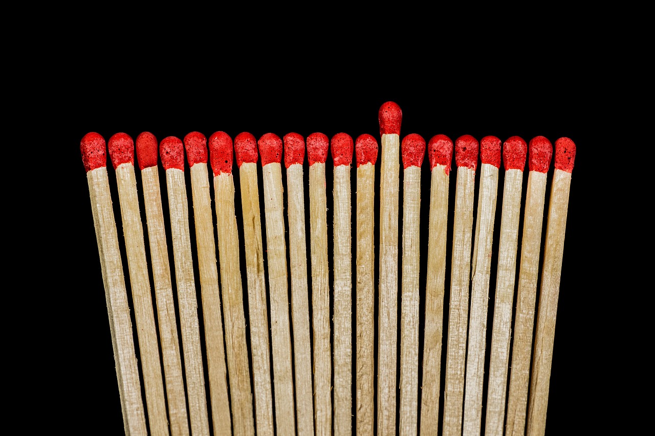 Wooden matches symbolize potential risk and escalation in AI development debates.
